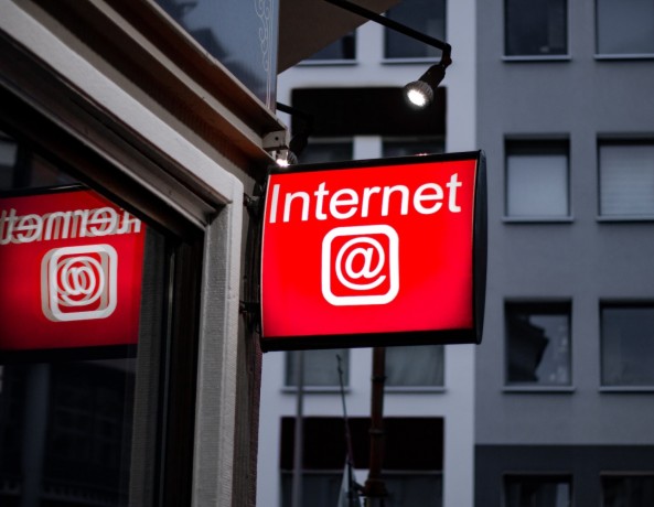 Internet LED signage beside building near buildings