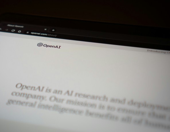 OpenAI website displayed on a laptop screen