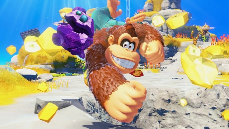 Donkey Kong punching through golden gems in colorful landscape