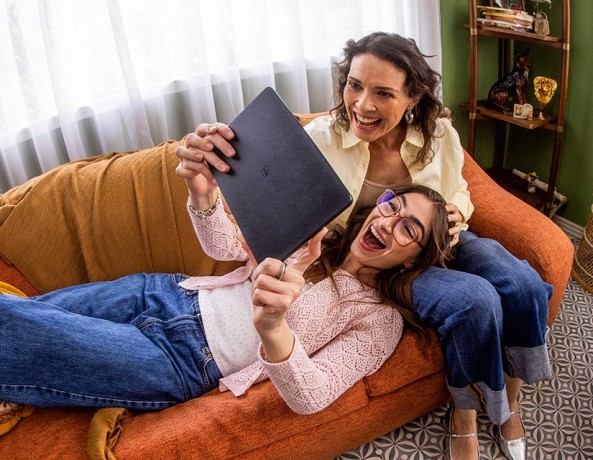 Two people using a T-Mobile Revvl Tab 2 tablet