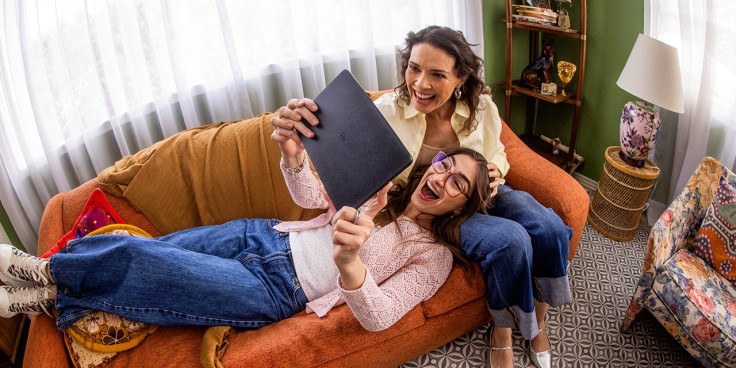 Two people using a T-Mobile Revvl Tab 2 tablet