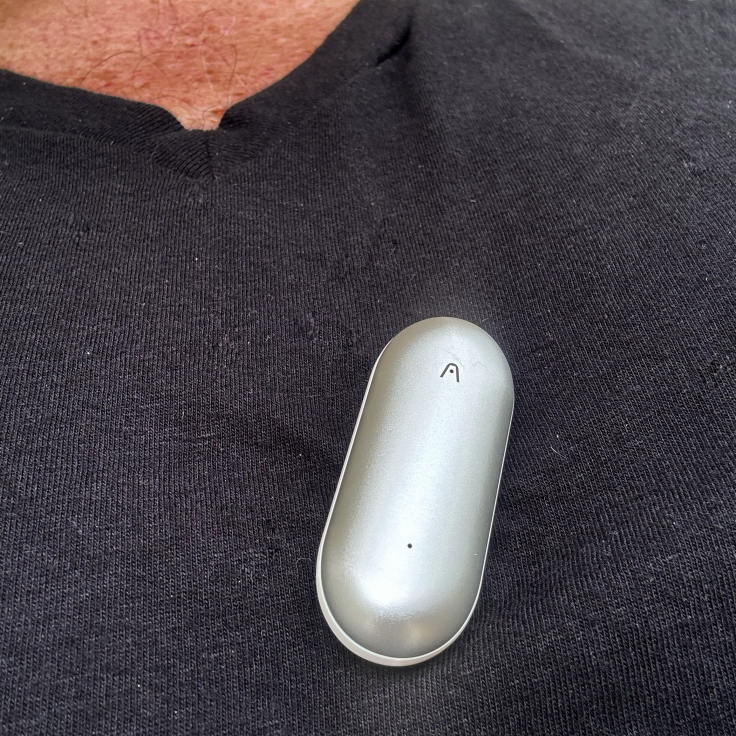 Notepin clipped to shirt collar