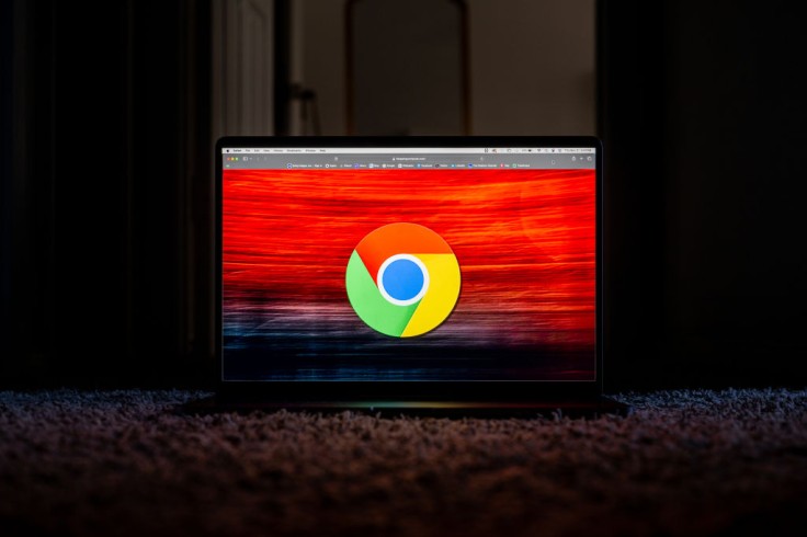 Laptop screen showing Chrome logo on red background
