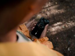 Person Holding Smart Phone with Low Battery