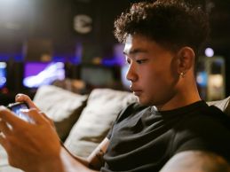 guy playing game in mobile