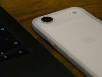 iPhone Air Beside a Laptop