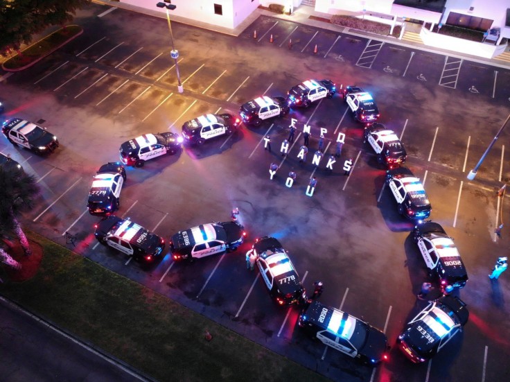 The Fort Myers Police Department makes heart out of police cars to thank health workers at Lee Memorial Hospital